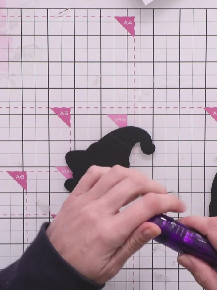 Step 4: Apply glue or tape to the top section of the hinge area on your gnome card pieces.