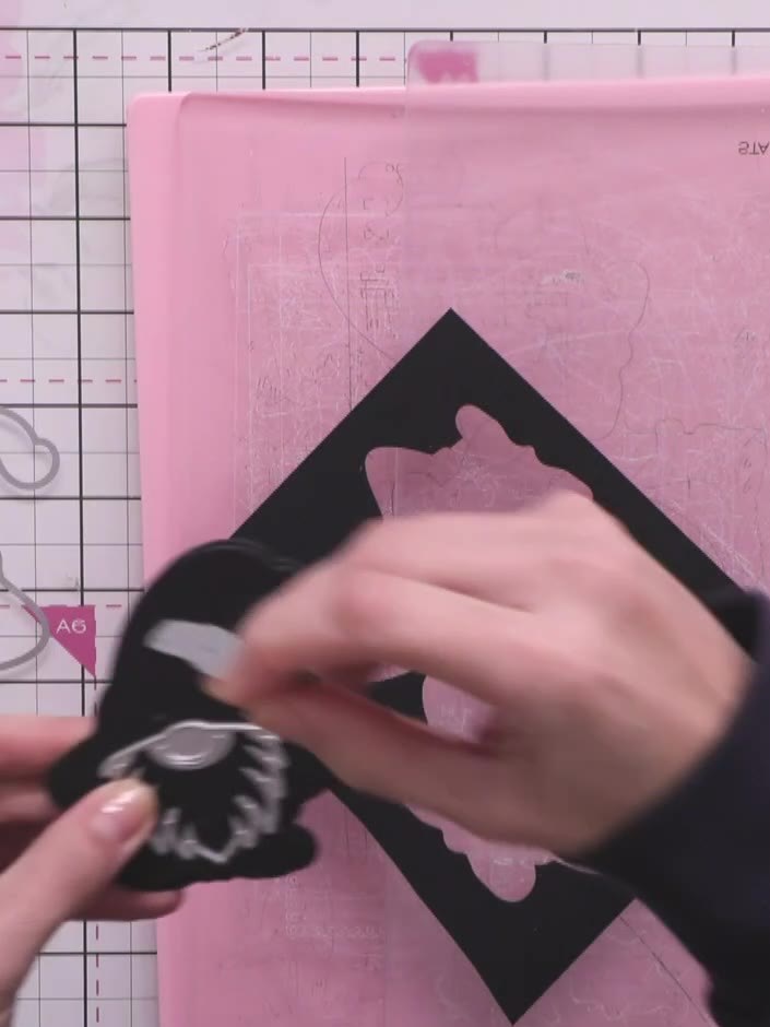 Step 6: Cut the gnome's beard from white card stock using the beard die or template. Position the die on white card an
