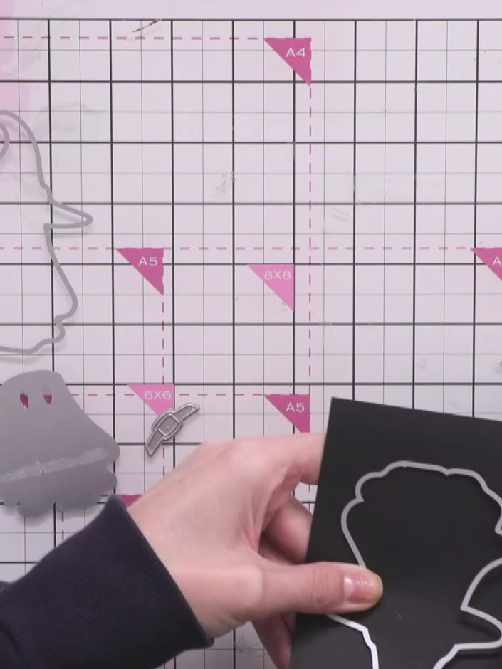 Step 1: Cut the ghost exterior die from black card stock. Use the die cutting machine to cut out the ghost shape.