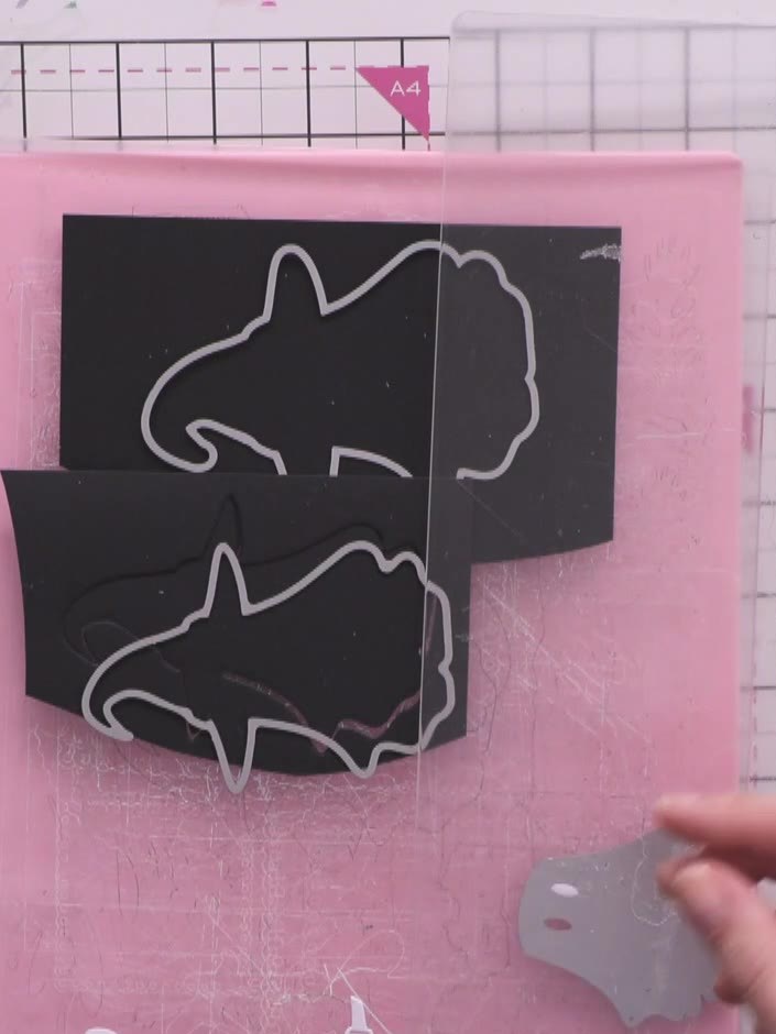 Step 4: Cut out the ghost's belt piece from white card stock using the die-cut shape as a guide.