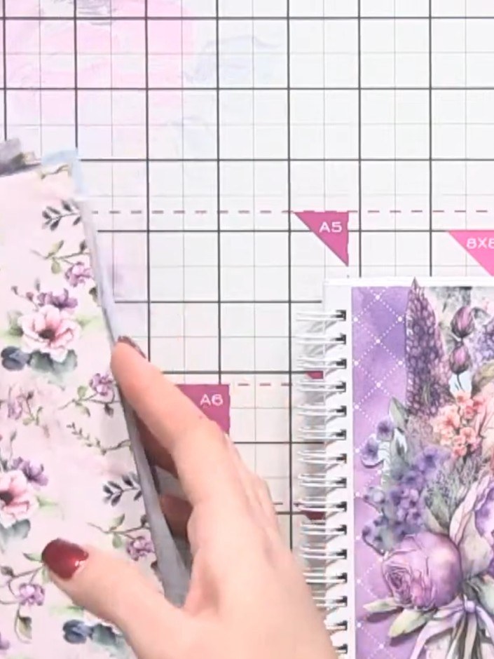 Step 3: Fold the cut floral bouquet piece in half to create a symmetrical shape. Carefully cut away any excess paper t