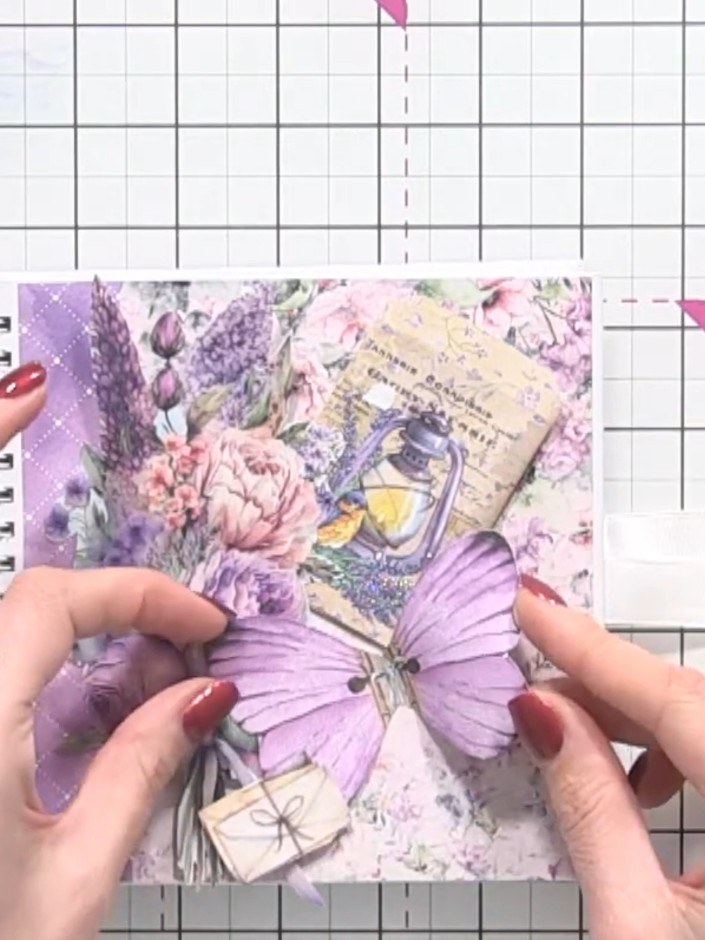 Step 7: Tear a piece of vellum from the Ethereal Love set and position it beneath the butterfly wings to add dimension