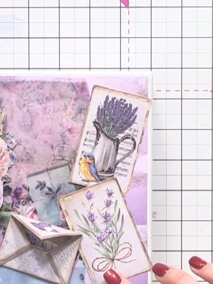 Step 9: Arrange all the decorative elements on the album cover, including the layered floral bouquet, envelope pockets
