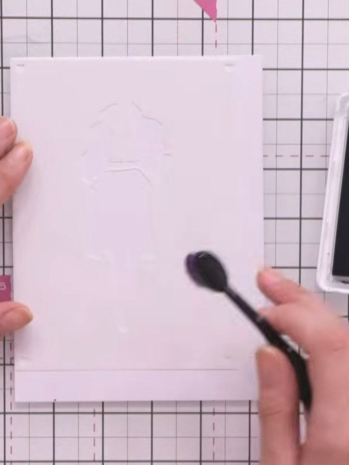 Step 3: Apply a light shade of teal ink through the first stencil using an ink brush, pressing gently onto the card. H