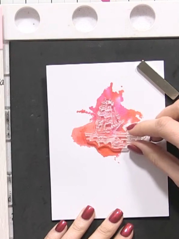 Step 7: Position the ship detail stamp over the watercolour splash background. Align the stamp where you want the boat