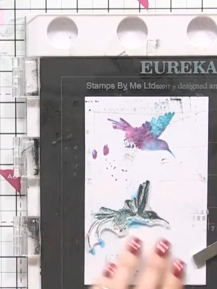 Step 10: Repeat the stamping process on the second watercolour background piece. Stamp the hummingbird images using the