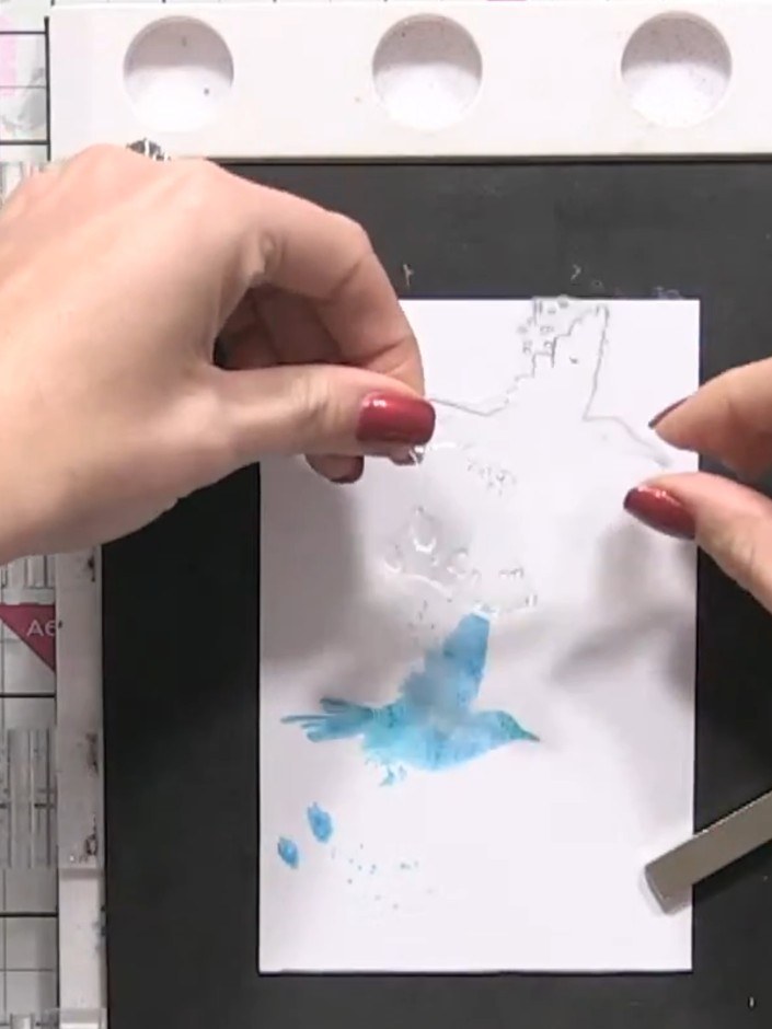 Step 4: Lift the stamp away from the card and set it aside. Allow the watercolour image to dry naturally, or use a hea