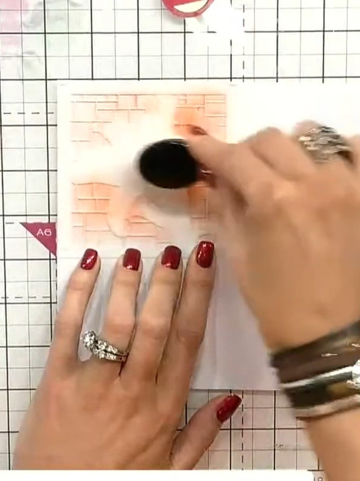 Step 6: Trage die zweite Farbe durch Schablone zwei auf. Use a blending brush or sponge to dab the red ink through the ste