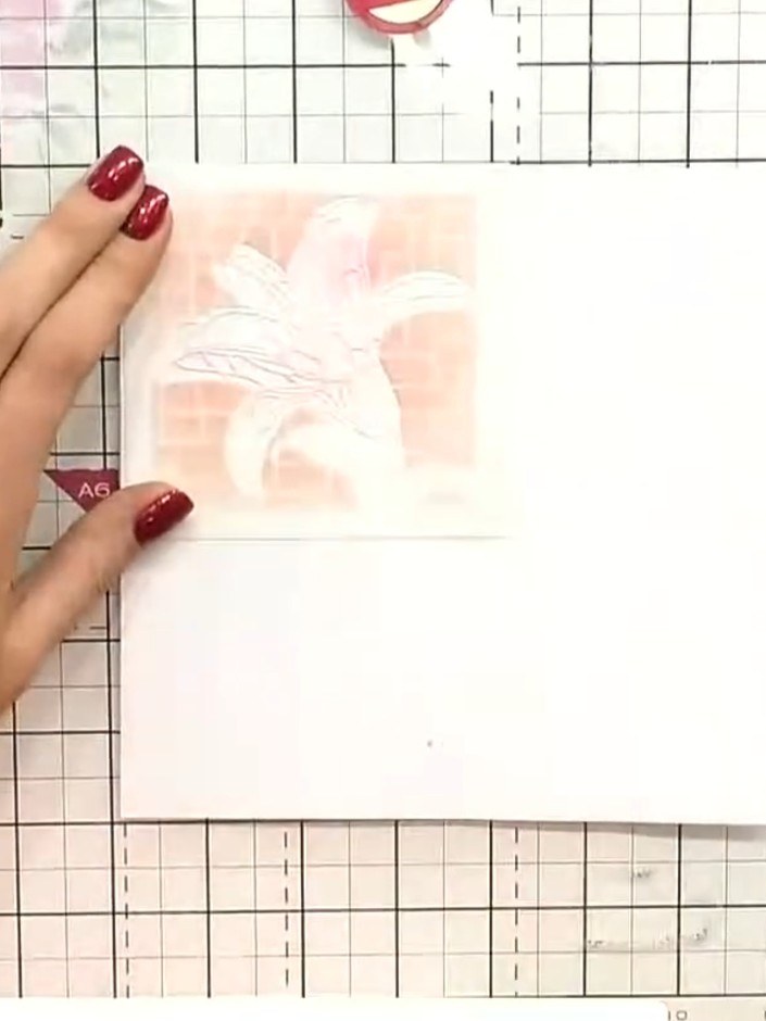 Step 8: Once all stencil layers are complete and dry, stamp a sentiment or design in the centre of your card using bla
