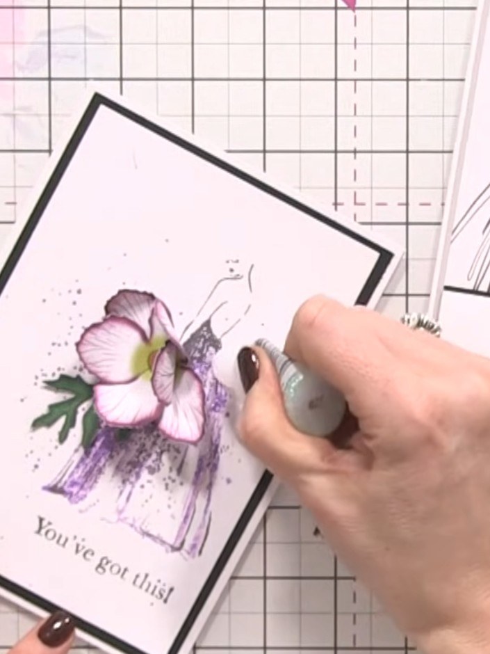 Step 11: Add small foliage sprigs around the flower arrangement to create a natural, flowing composition. Position the 