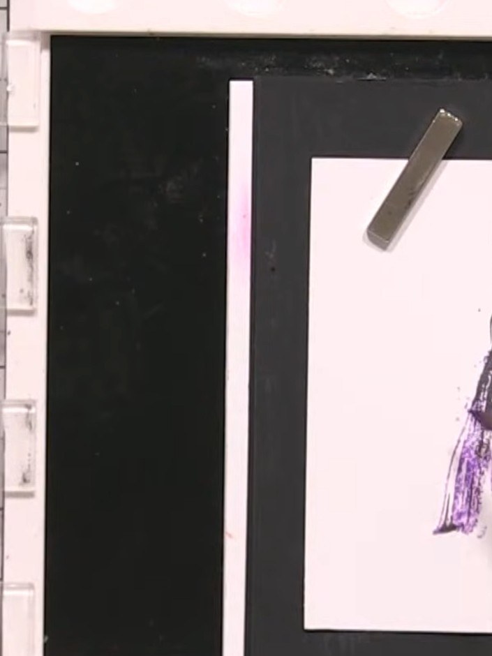 Step 5: Add purple ink speckles around the dress area using a brush to create an artistic splatter effect. Allow the s