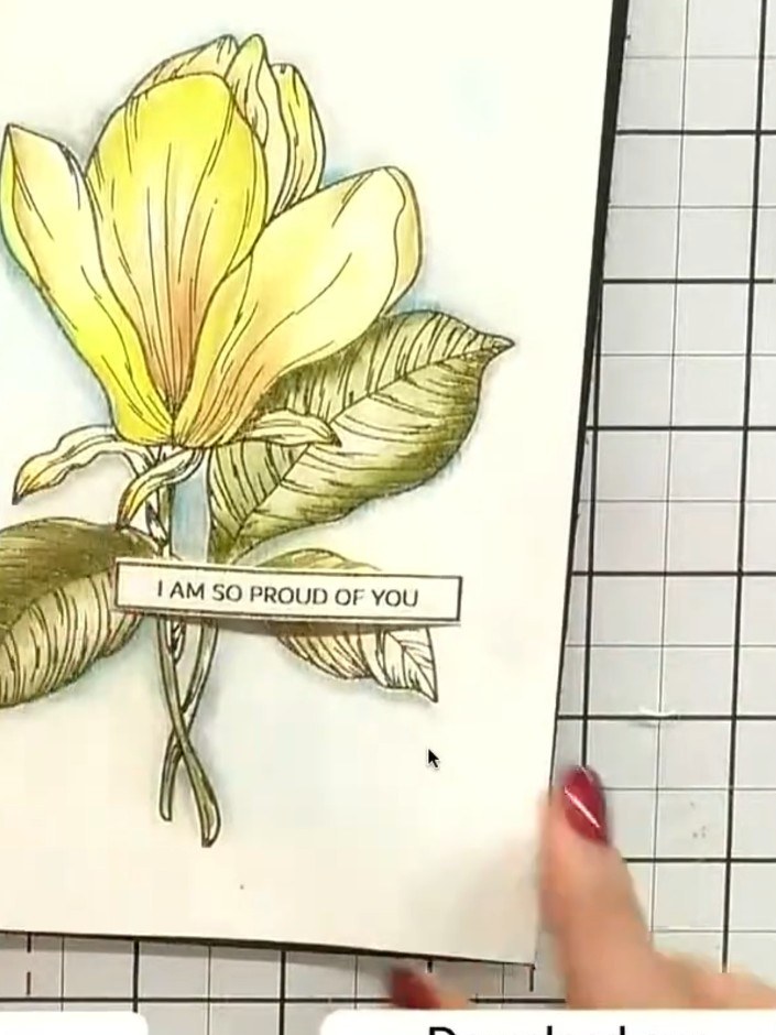 Step 6: Position the sentiment sticker on the card where there is open space on the watercolour design. Press down fir