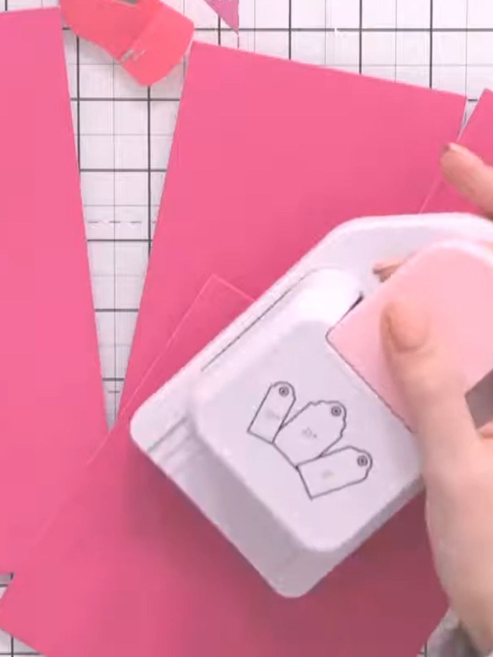 Step 1: Take an offcut piece of pink card and cut it down the centre lengthways using scissors or a punch to create a 
