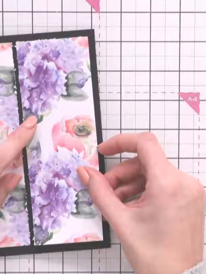 Step 4: Cut a strip of black card stock to act as a connector piece between your two floral paper halves. Position it 