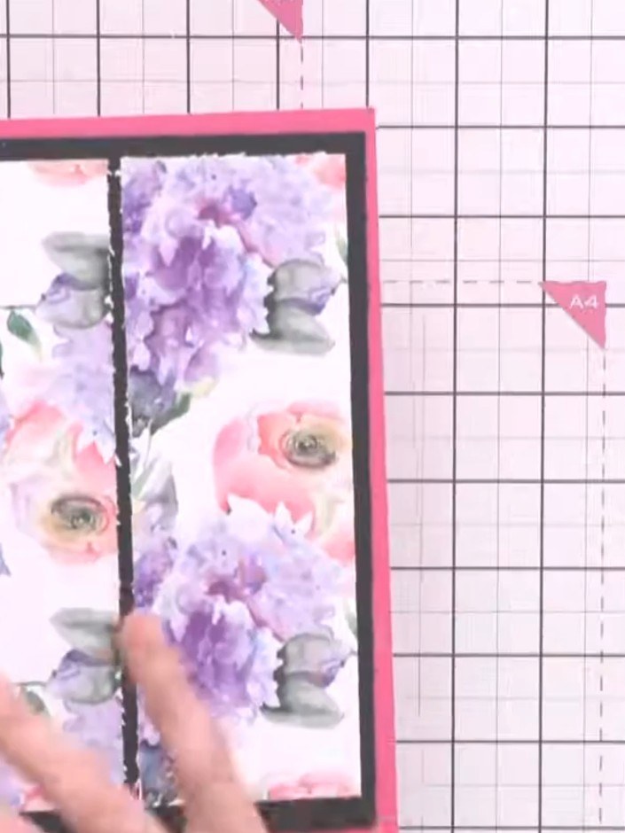 Step 5: Adhere the first patterned paper panel to the pink card base, positioning it on the left side with the black b