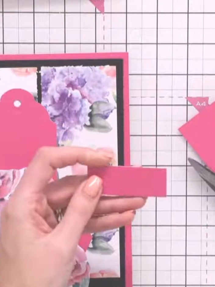 Step 2: Cut a strip of pink card stock to create the pocket opening detail on the front of your card. Position it acro