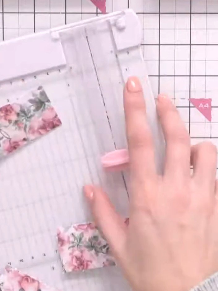 Step 2: Select four different patterned papers from your pad. Using your scoring board and trimmer, cut each paper to 