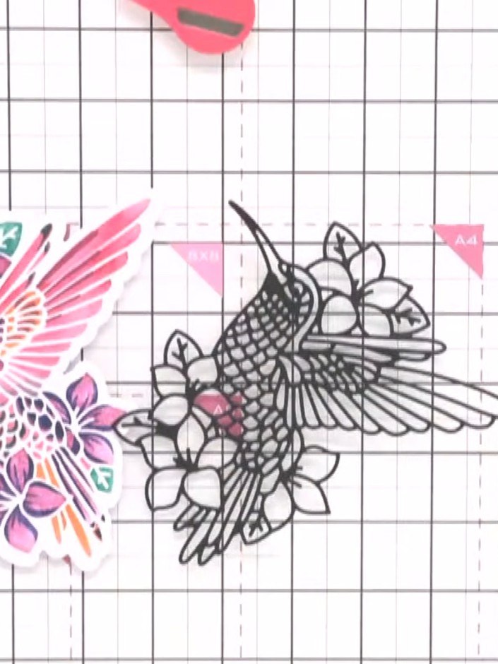 Step 11: Position the black detailed die-cut hummingbird piece on top of the coloured stencilled hummingbird. Secure it