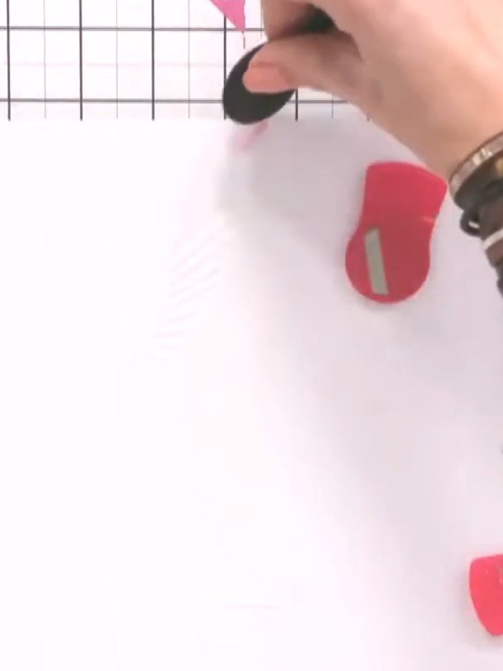 Step 2: Apply pink ink through the heart stencil using an ink dauber. Work the ink through the heart guides to create 