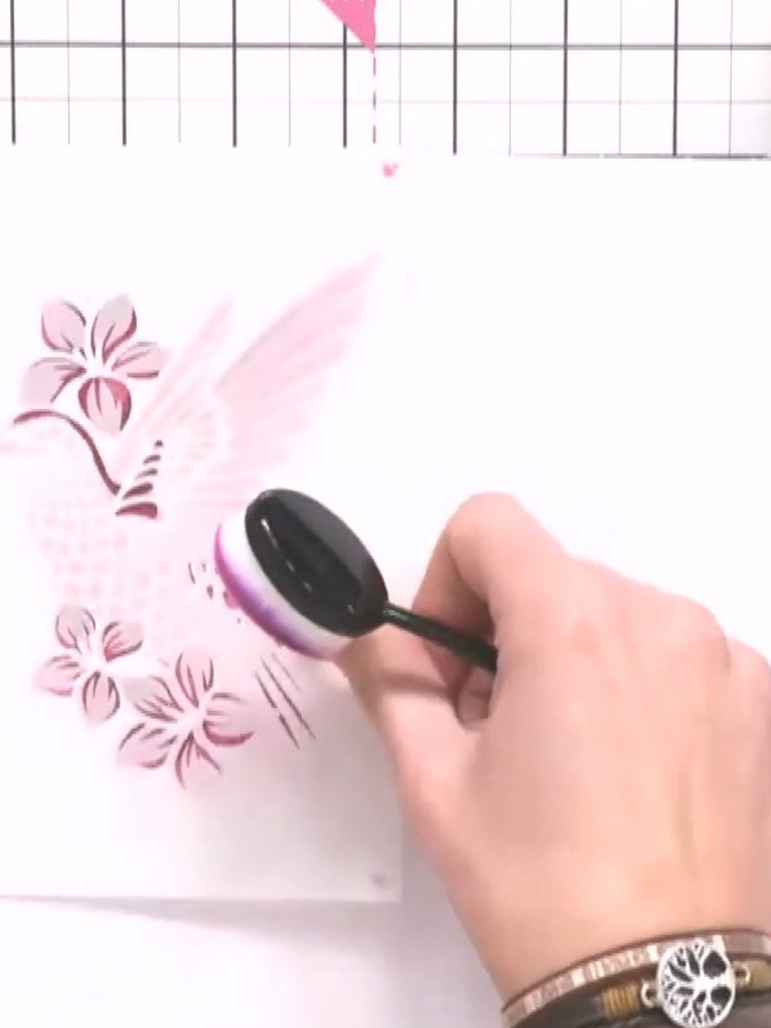 Step 7: Apply stencil six for the leaves using green ink. Layer teal ink at the base of the leaves for added dimension