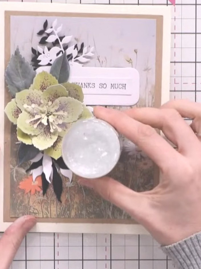 Step 12: For an optional glass-like finish, apply colourless glitter or sparkle media to the white circular element on 