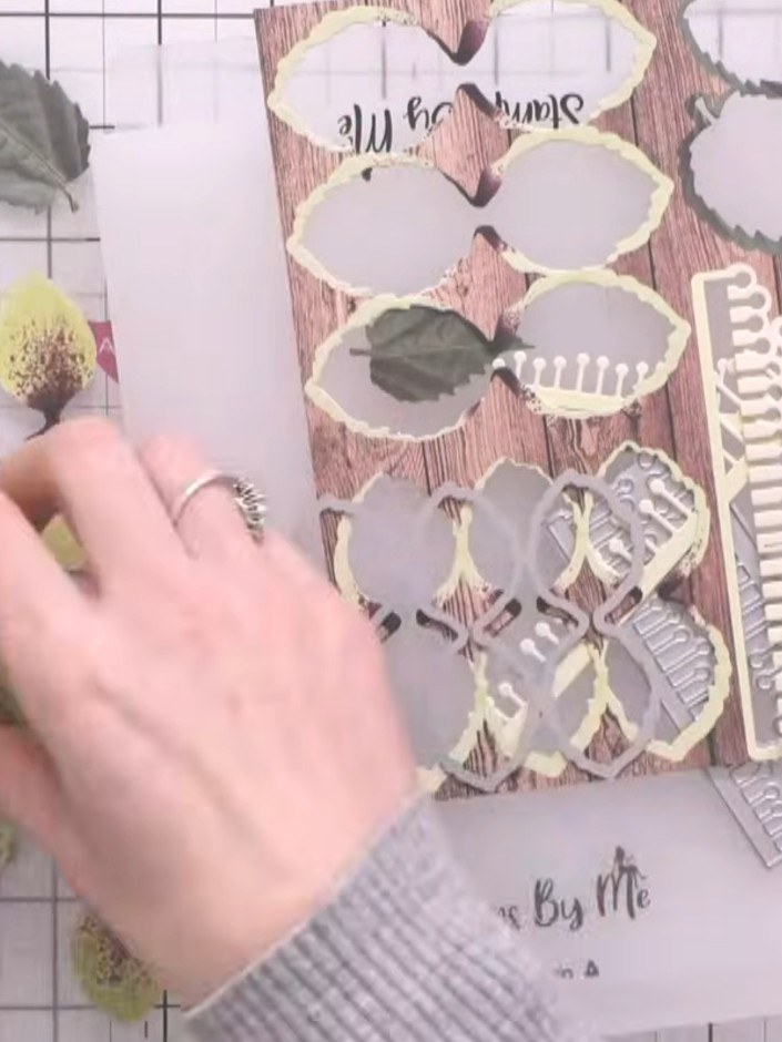 Step 4: Remove all the die-cut hellebore flower pieces from the cutting plate. Carefully pop out each petal and flower