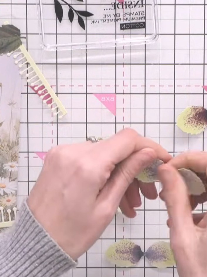 Step 6: Use a white ink pad to soften the edges of the hellebore petals, blending away any harsh lines to create a mor