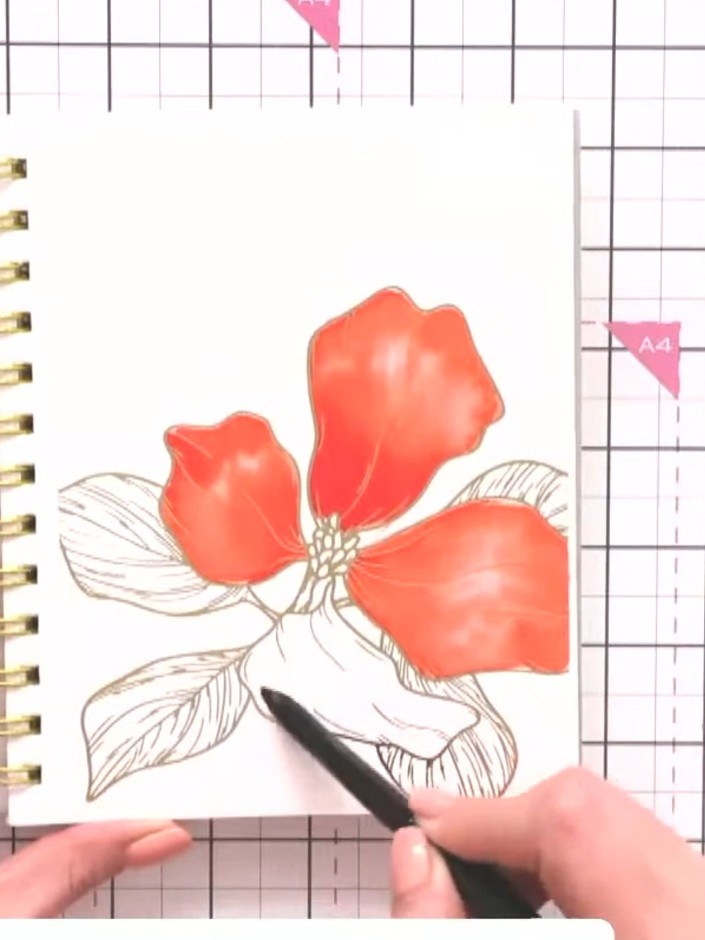 Step 2: Using a wet brush, apply water to one petal area of the botanical design on the page. Work on one petal at a t