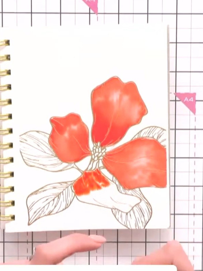 Step 4: Allow the gold foil to resist the watercolour ink, creating natural colour variation in the petals and leaves.