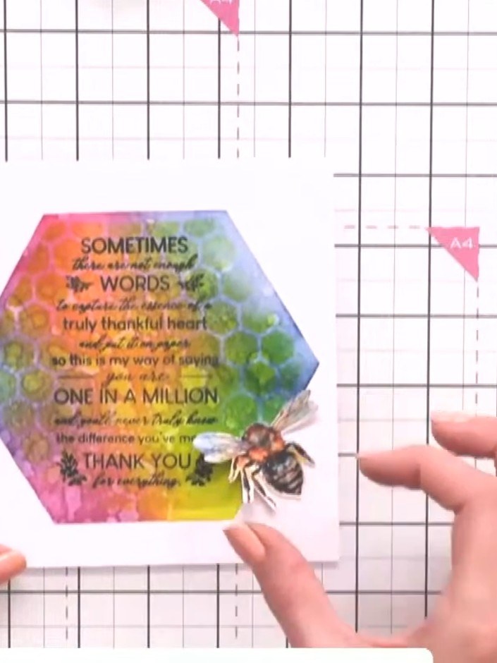 Step 4: Position the fussy-cut bee onto your card in your chosen location. Press down gently to secure the bee embelli