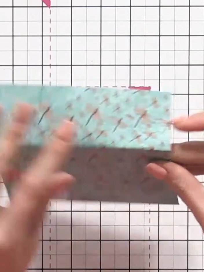 Step 4: Tuck the top flap (turquoise patterned section) into the base pocket of the wallet. Alternatively, fold the fl