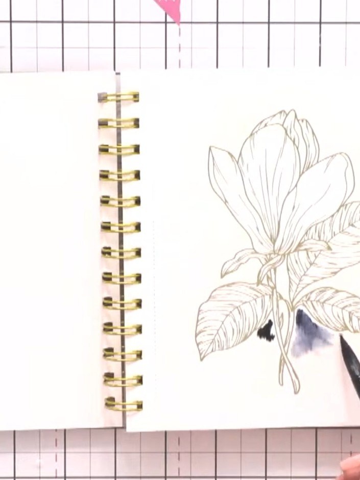 Step 4: Drop the concentrated purple watercolour into the wet area around the magnolia design. Allow the colour to blo