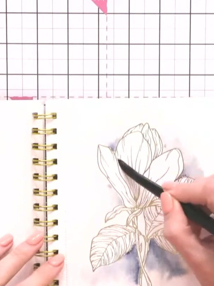 Step 7: Dampen a petal with clean water using a wet brush. Tap pink ink from your ink pad onto the dampened petal, the