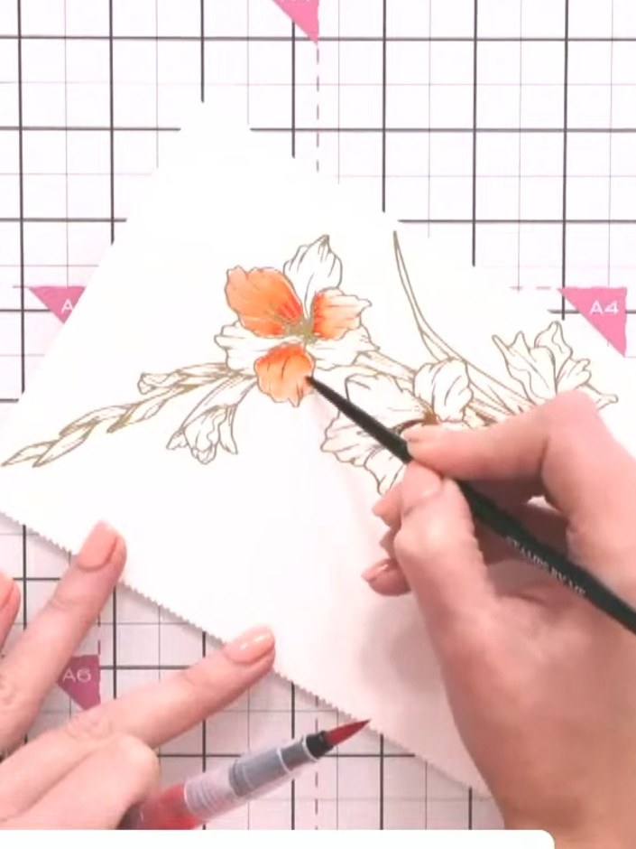 Step 7: Continue adding colour to adjacent petals using different shades of orange and coral. Use the watercolour brus