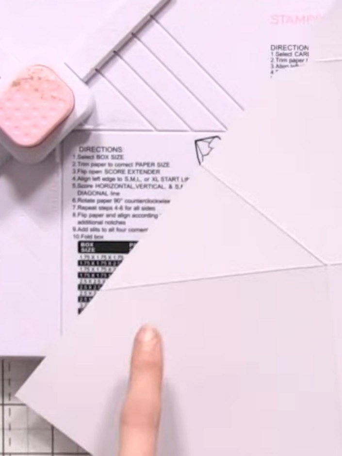 Step 5: Turn the template over to the reverse side. Punch out the small recesses marked on the template using your fin