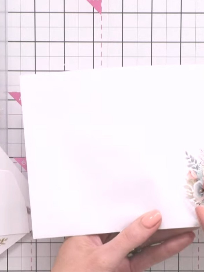 Step 3: Position the rub-on transfer in the corner of your envelope, image-side down. Ensure the floral design is plac