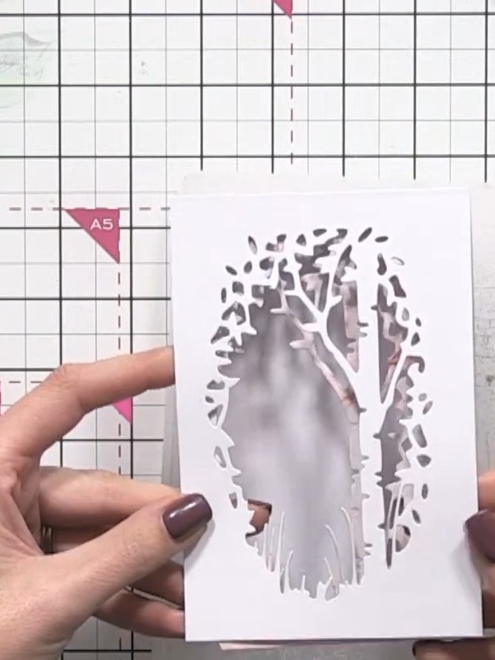 Step 7: Position the drop shadow piece slightly behind the white aperture window piece to create a sense of depth and 