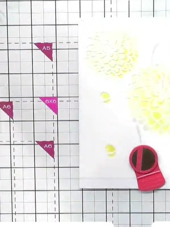 Step 3: Remove the first stencil and position the second stencil, lining it up with the edge of your card. Apply orang