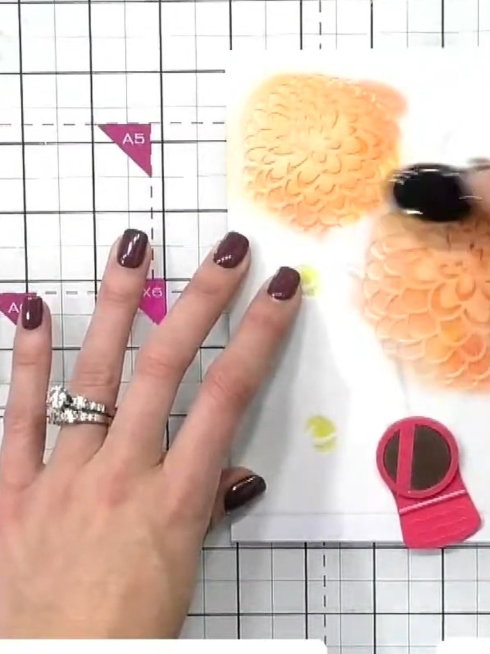 Step 4: Position stencil three over your design and apply pink ink using a blending brush, building up the colour to a