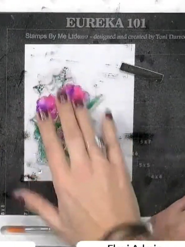 Step 4: Lightly spray the stamped image with water using a spray bottle to blend the colours together and allow them t