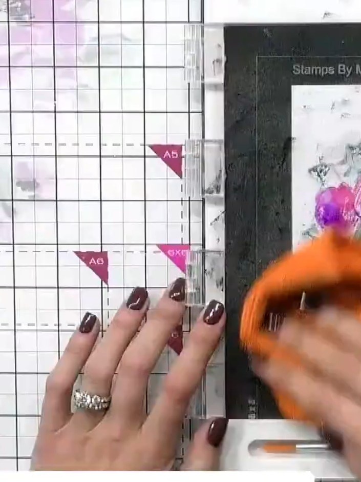 Step 6: Position the detailed outline stamp over your dried coloured floral image. Stamp down firmly in a coordinating