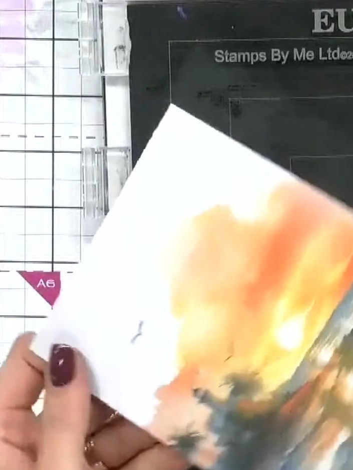 Step 9: Add gold embossing powder to the stamped image. Sprinkle the powder generously over the wet ink to ensure full
