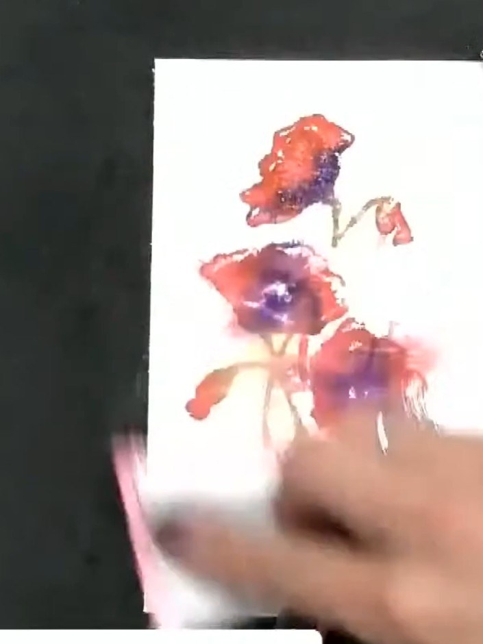 Step 8: Stamp the floral image onto white watercolour card using black ink, pressing down firmly to ensure all the det