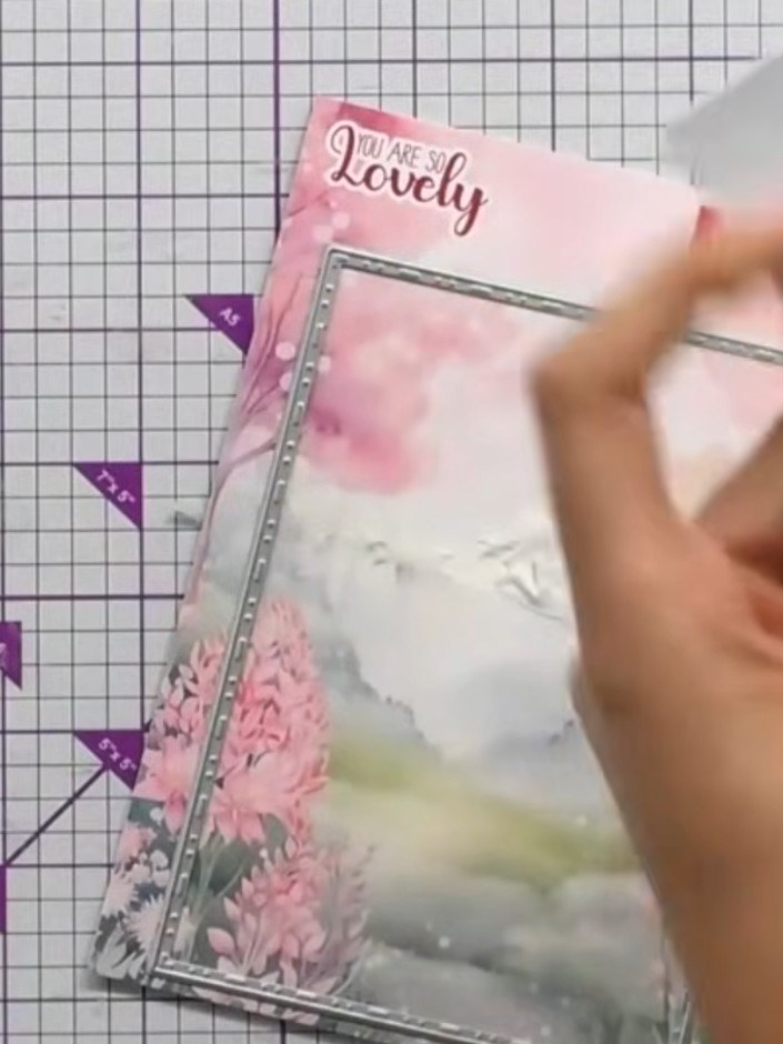 Step 1: Take a card blank from your stash and position the You Are So Lovely aperture die in the centre of the card fr