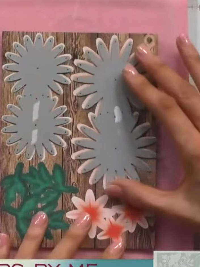 Step 6: Layer the die-cut chrysanthemum flowers together using dry clear glue, building up dimension by stacking the g
