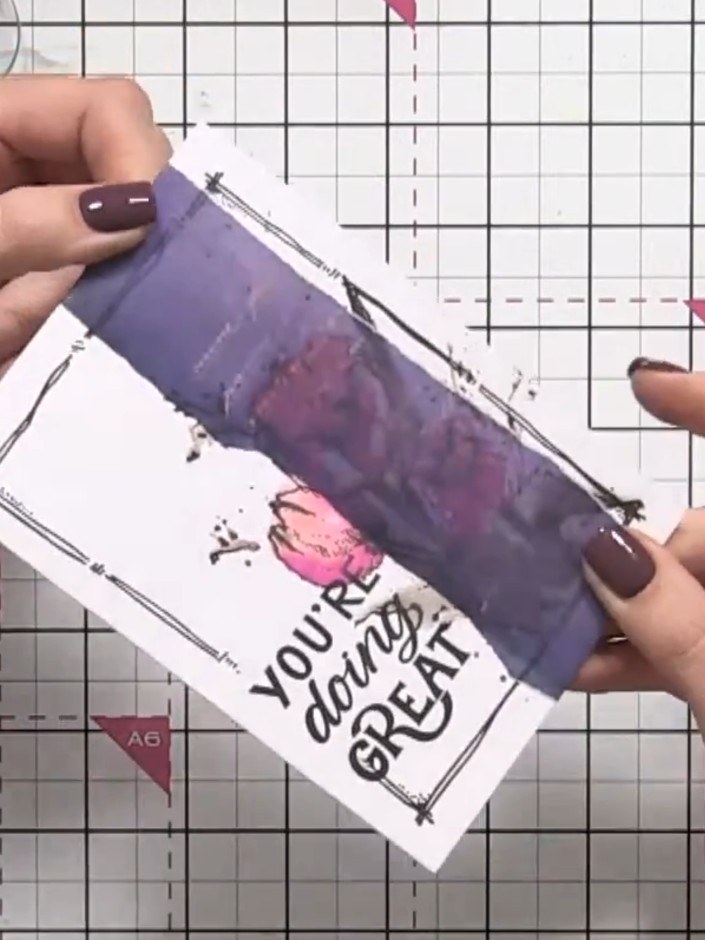 Step 3: Flip the vellum overlay over to the reverse side. Apply tape runner adhesive to the back of the vellum, positi