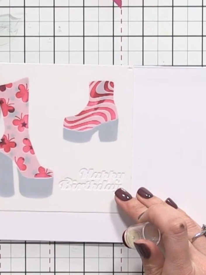 Step 10: Use the die to cut out the completed shoe design from the card. Position the die over the stamped and coloured