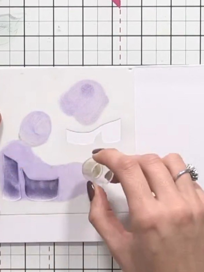 Step 3: Using black ink, apply it through the stencil to create the darker details of the shoe design, including the h