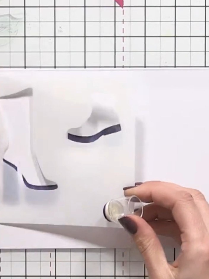 Step 4: Remove the first stencil and position stencil number two over the design, carefully aligning it with the regis