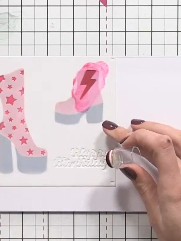 Step 9: Apply glitter glue to the stars on the pink star-patterned boot and to the wedge heel of the pink lightning bo